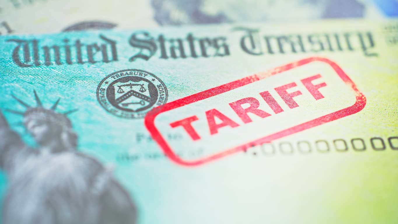 Close-up of a U.S. Treasury check with the Treasury seal, overprinted with a large red rubber stamp reading TARIFF